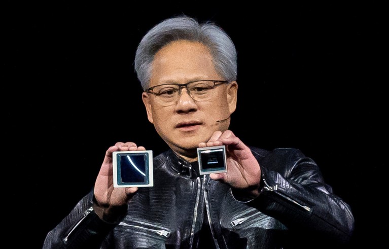 Jensen Huang, co-founder and chief executive officer of Nvidia Corp., displays the new Blackwell GPU chip, left, and the Hopper GPU chip, right, during the Nvidia GPU Technology Conference (GTC) in San Jose, California.