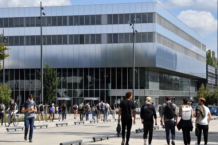 Students walk past the Paris-Saclay University in Saclay, on the outskirts of Paris.
