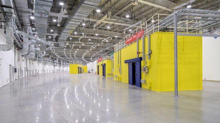 A view of the installed bright yellow beamline hutches.