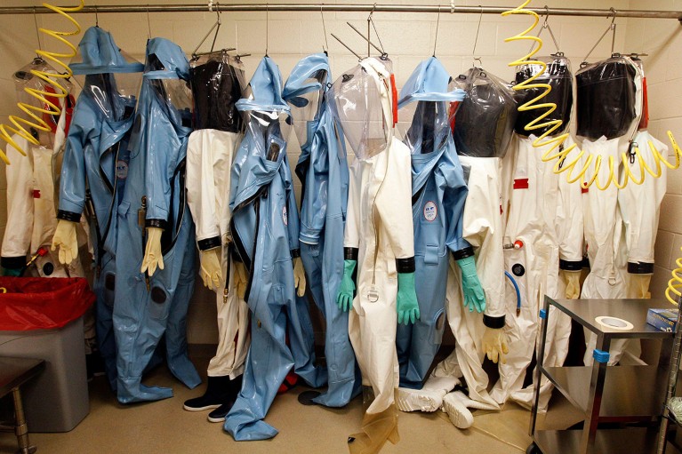 Biohazard suits hang in a Biosafety Level 4 laboratory in the U.S.