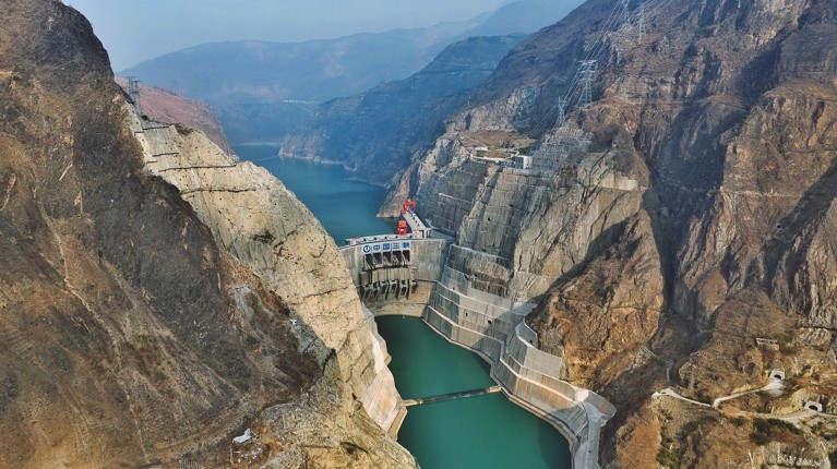 An aerial photo shows Wudongde Hydropower Station damming the Jinsha River.