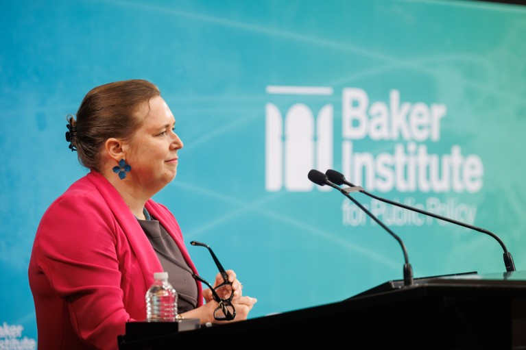 Close-up of Elaine Howard Ecklund speaking at a conference