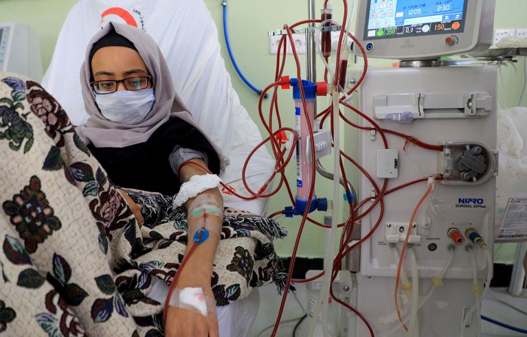 A young woman suffering from kidney failure undergoes dialysis.