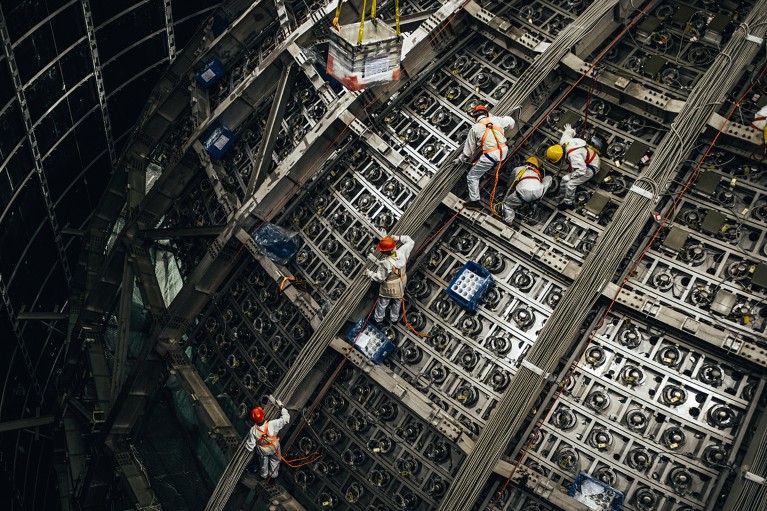 Aerial view of five people working at a construction site