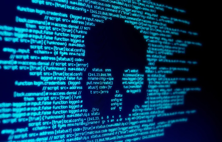 Blue text of computer code laid out to create the image of a skull.