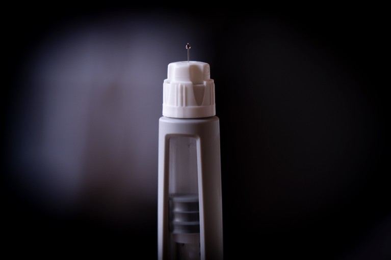 Close-up of an injection pen, showing the small needle