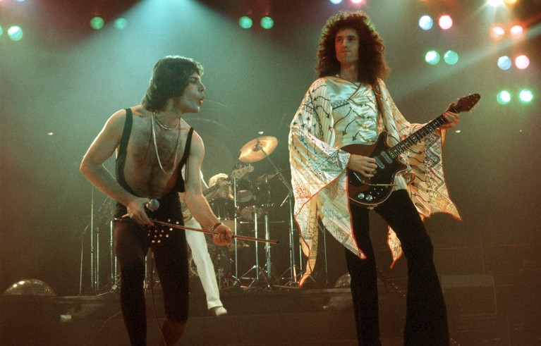 Queen's Freddie Mercury and Brian May performing onstage in the 1970s.