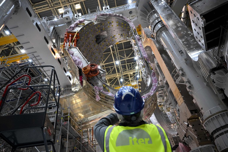 A man takes a picture of a module being assembled at the international nuclear fusion project Iter in Saint-Paul-les-Durance, southern France.