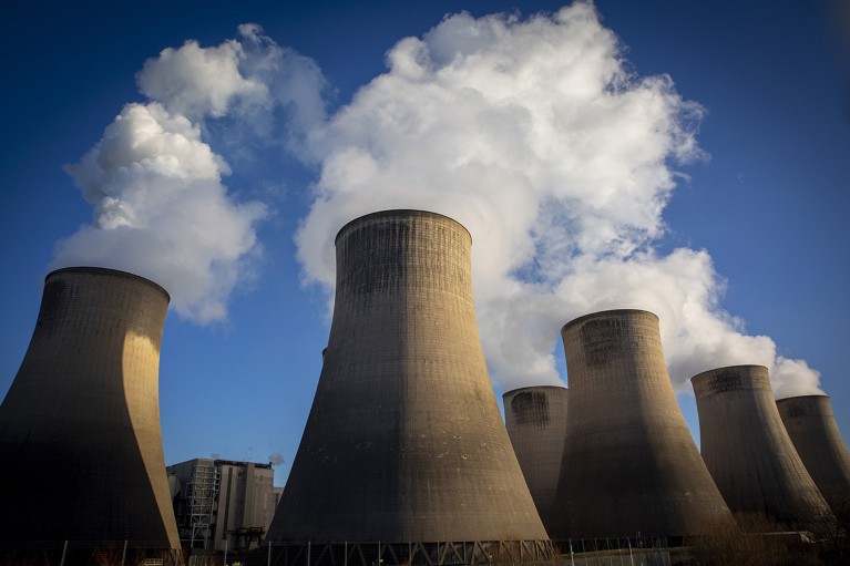 Smoke and steam bellows from the chimneys and cooling towers of Ratcliffe-on-Soar coal fired power station in England.