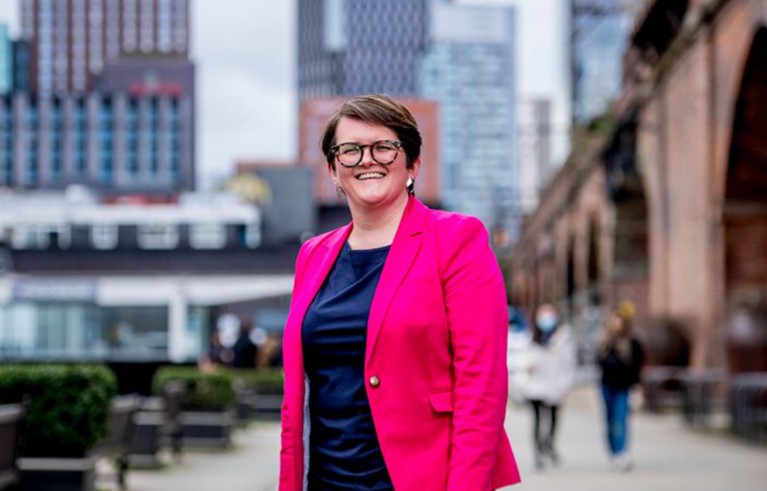 Carly McLachlan stands in a street in London.