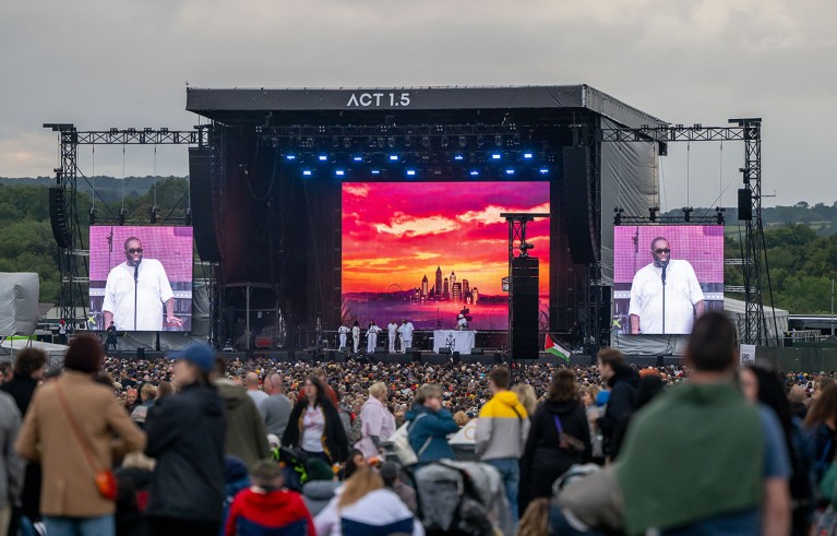 Crowd shot with stage in the background at the Massive Attack concert.