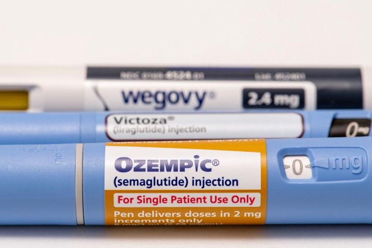 A close-up of three injectable prescription weight loss medicines titled Ozempic, Victoza and Wegovy