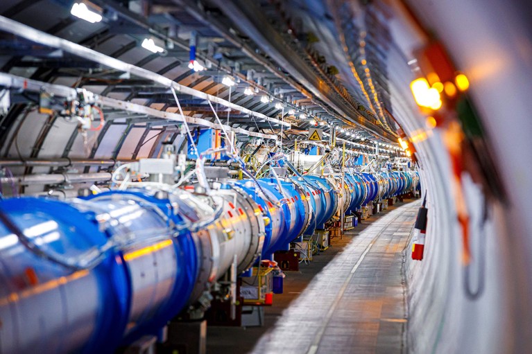 Some of the 1232 dipole magnets that bend the path of accelerated protons are pictured in the Large Hadron Collider (LHC) in a tunnel of the European Organisation for Nuclear Research (CERN).