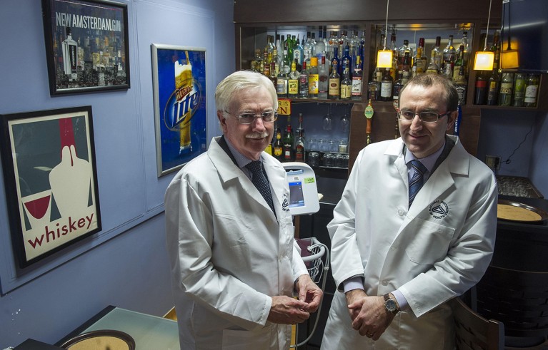 George Koob and Lorenzo Leggio pose for a photograph in a research laboratory designed as a bar inside the National Institutes of Health’s hospital.