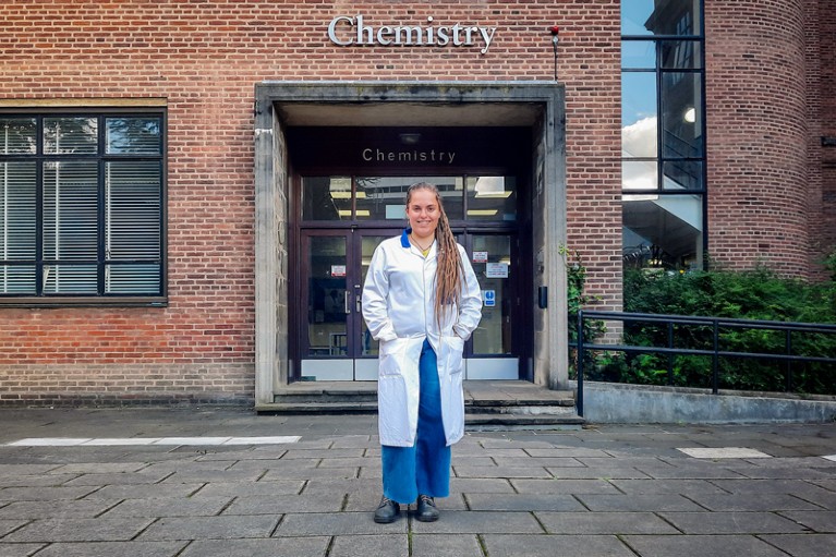 Frances Longbottom, wearing a white lab coat, stood outside the Chemistry Department at the University of Hull