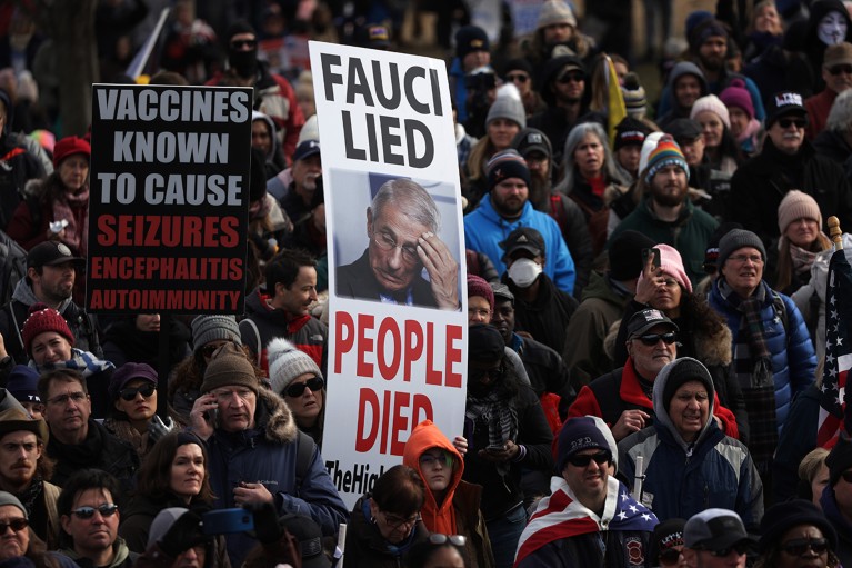 Anti-vaccination activists march and hold signs at a protest in Washington, D.C., US in 2022.