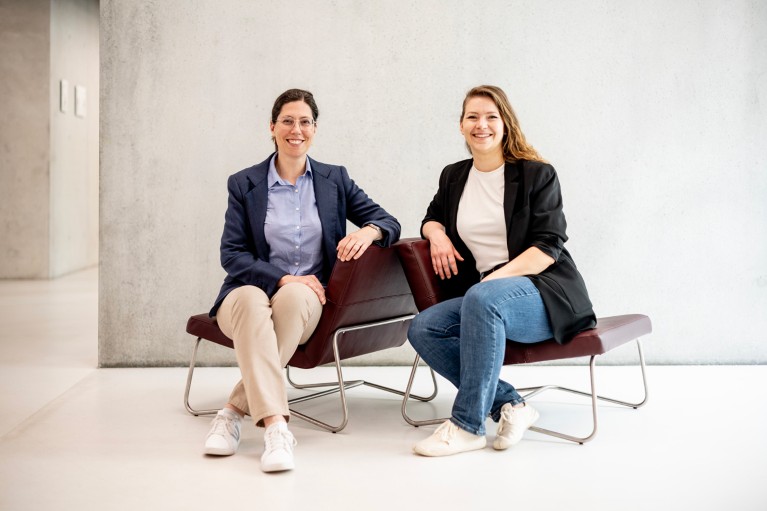 Gaëlle Andreatta (left) and Julia Carpenter pose for a portrait while sitting on chairs