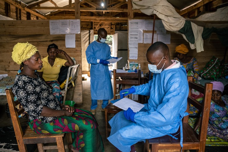 A doctor speaks to a patient about the progress of treatment for mpox in Democratic Republic of the Congo.