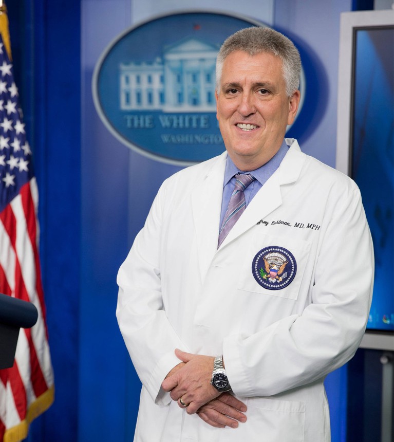 Dr Kuhlman posing in the White House Press Briefing Room in the West Wing of the White House.