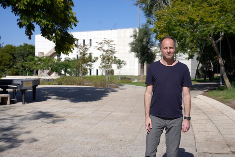 Omri Herzog standing in an outdoor space on the campus of Sapir College