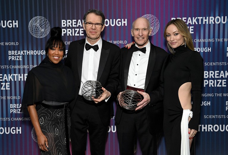 (L-R) Regina King, honoree Dr. Michel Sadelain, honoree Dr. Carl H. June, and Olivia Wilde pose with awards during attend the 10th Breakthrough Prize Ceremony.