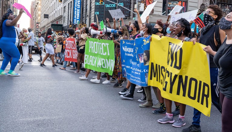 A line of banners at the front of the Black Womens/Womxn March Black Lives Matter Protest in July 2020 in New York, U.S.