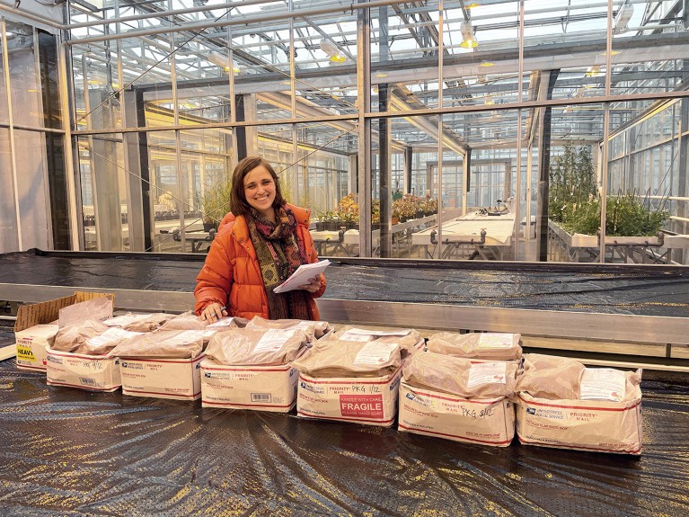 Rebecca Gonçalves in a greenhouse with 100 kilos of regolith soil from Mars.