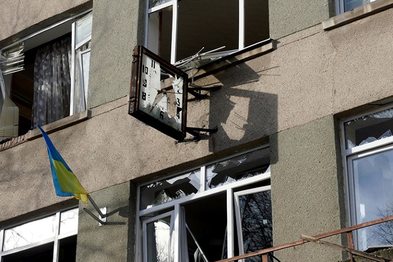 The Odesa Technical College is seen damaged with smashed windows and a smashed clock