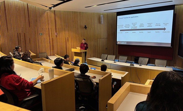 David Posner stands at a lectern while giving a talk at UNAM school of medicine, Mexico City.