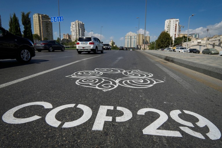 Close-up of the logo for the COP29 Climate Change Conference painted on a road in Baku