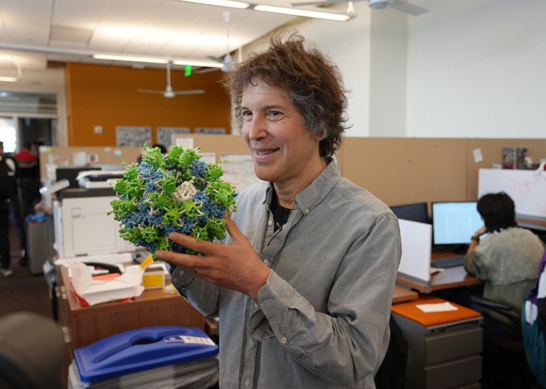 David Baker is seen posing with a 3D-printed protein