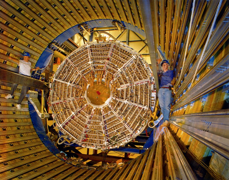 Two workers pictured inside the STAR Detector at Brookhaven's Relativistic Heavy Ion Collider.