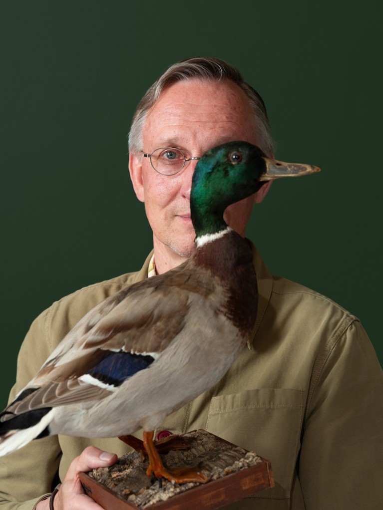 Kees Moeliker holding a stuffed duck