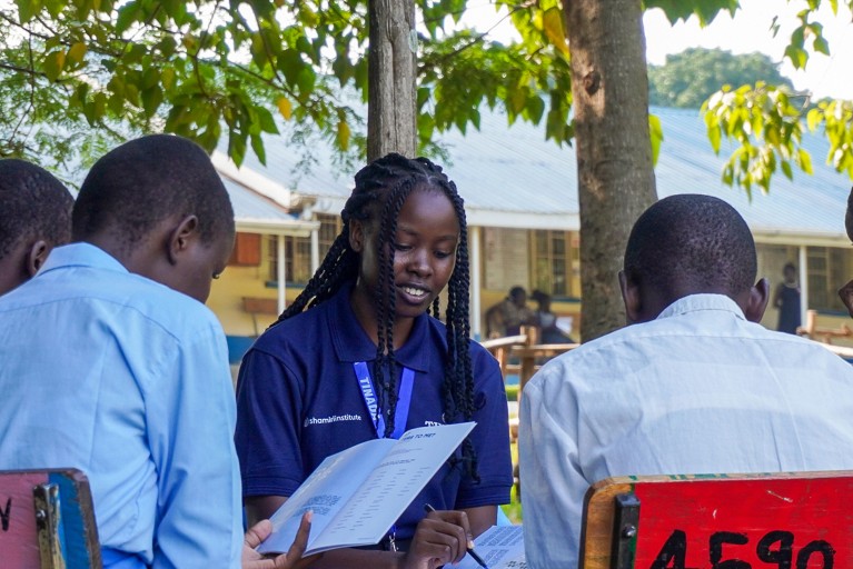 A group of students and a mentor at a Shamiri Event Group Discussion at a girls school in Kisumu, Kenya.