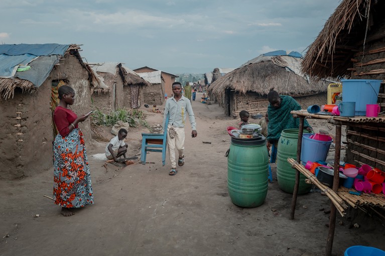 A family go about their daily life at the Tsere Displacement Site in Bunia, Ituri province, Democratic Republic of Congo.