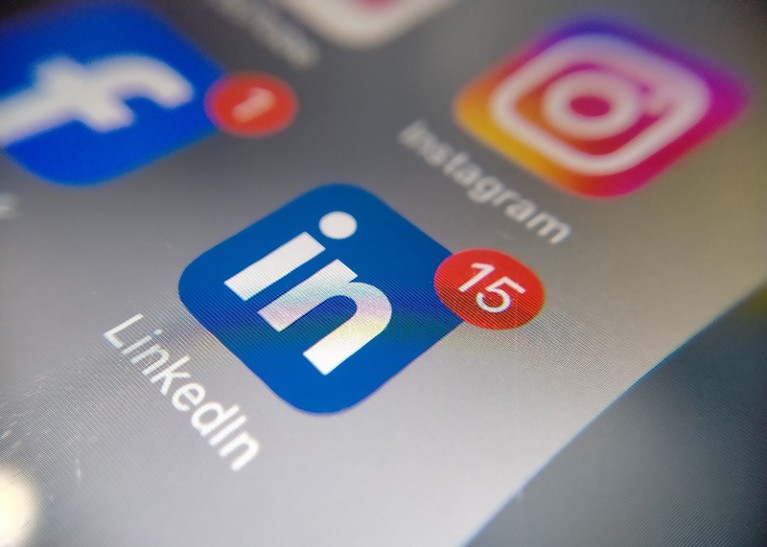 The LinkedIn app logo is seen on an iphone screen