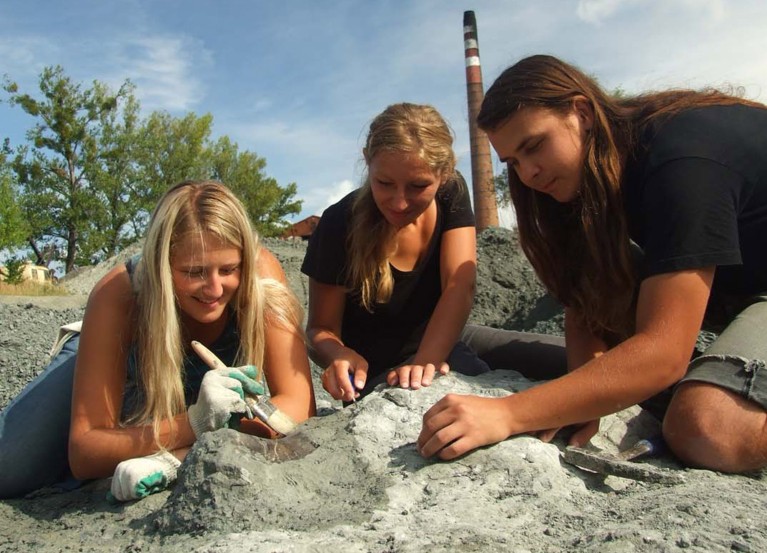 Three team members conduct excavations in the Late Triassic locality at Lisowice, Poland.