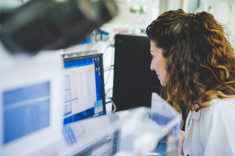 A researcher pictured using a FTIR spectrophotometer.