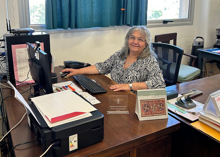 Yester Basmadjián sitting at her desk