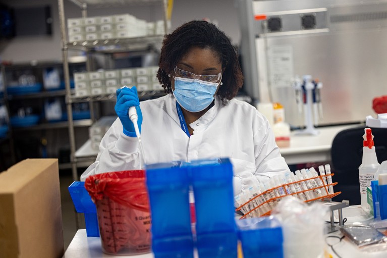 A microbiologists with the AEGIS Sciences Corporation processes Covid-19 and Monkeypox samples in a laboratory in Nashville, Tennessee.