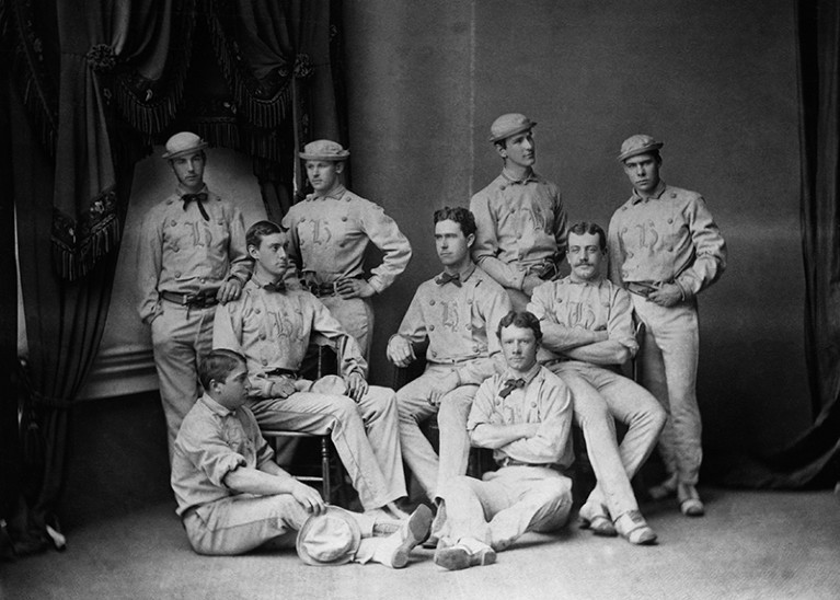 A black and white photograph of a nineteenth-century university sports team, all young men.