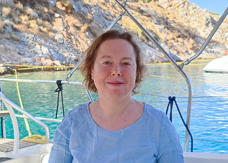 A photo of Victoria Doronina with the ocean behind her