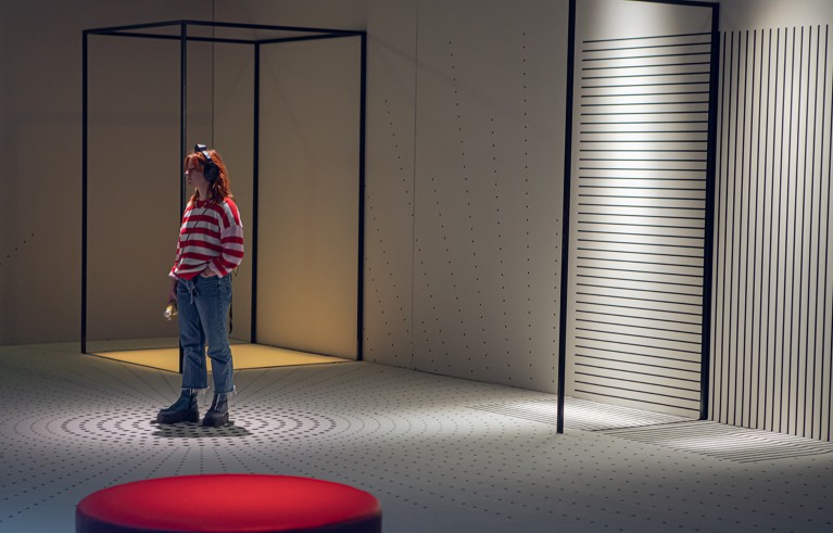 Woman in striped shirt standing in a circle.