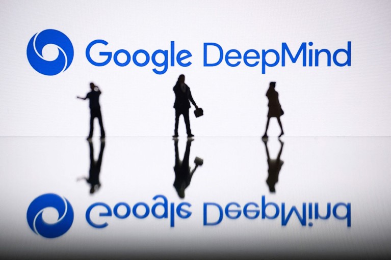 A photo illustration of silhouetted figurines next to a screen displaying a logo of Google DeepMind.