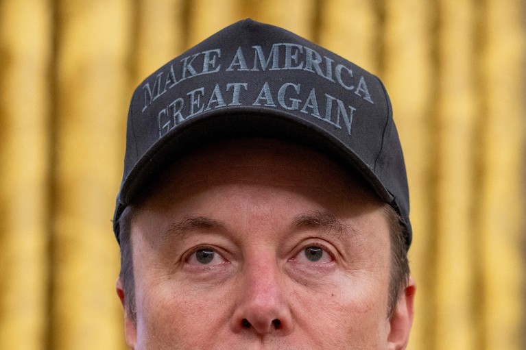 Close up of Tesla and SpaceX CEO Elon Musk wearing a black Make America Great Again hat.