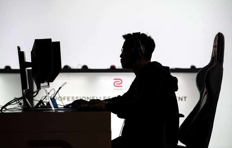 A participant sits at a computer monitor to play a video game at the 2019 DreamHack video gaming festival in Leipzig, Germany.