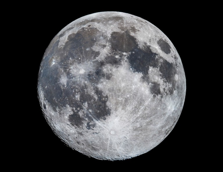 A nearly full Moon pictured with the south polar region tipped toward Earth.