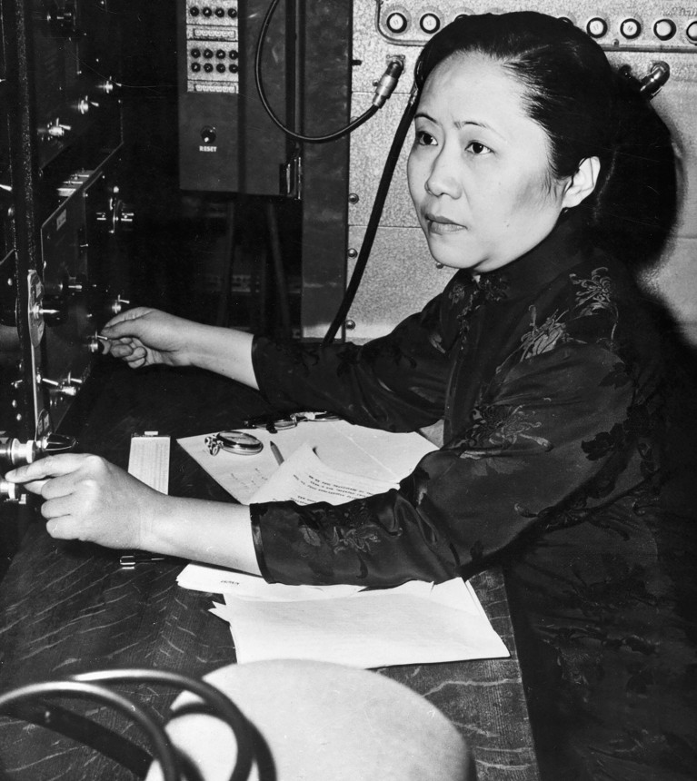 Chien-Shiung Wu sitting while operating a switchboard.