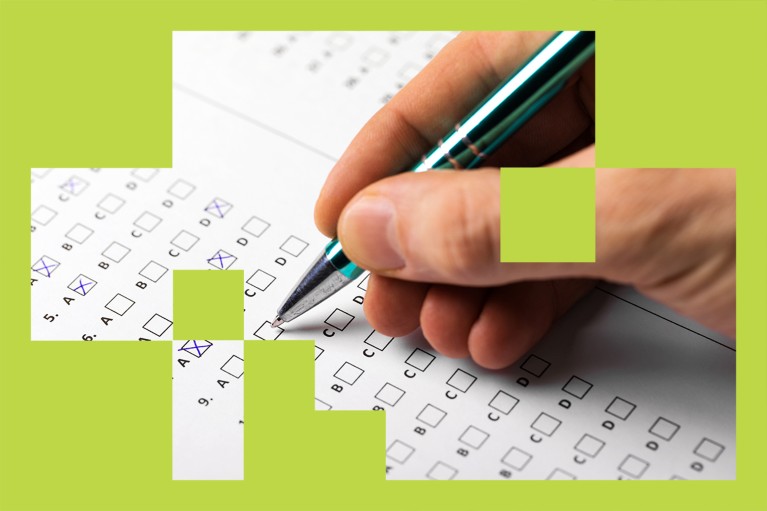 A hand holding a pen filling in a survey.