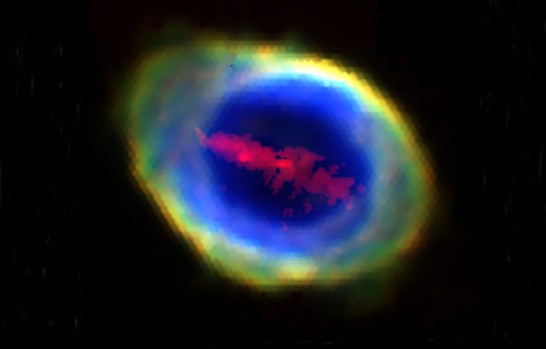 A composite RGB image of the Ring Nebula showing different oxygen and iron atoms in an oval shape. with brightness and contrast in space.